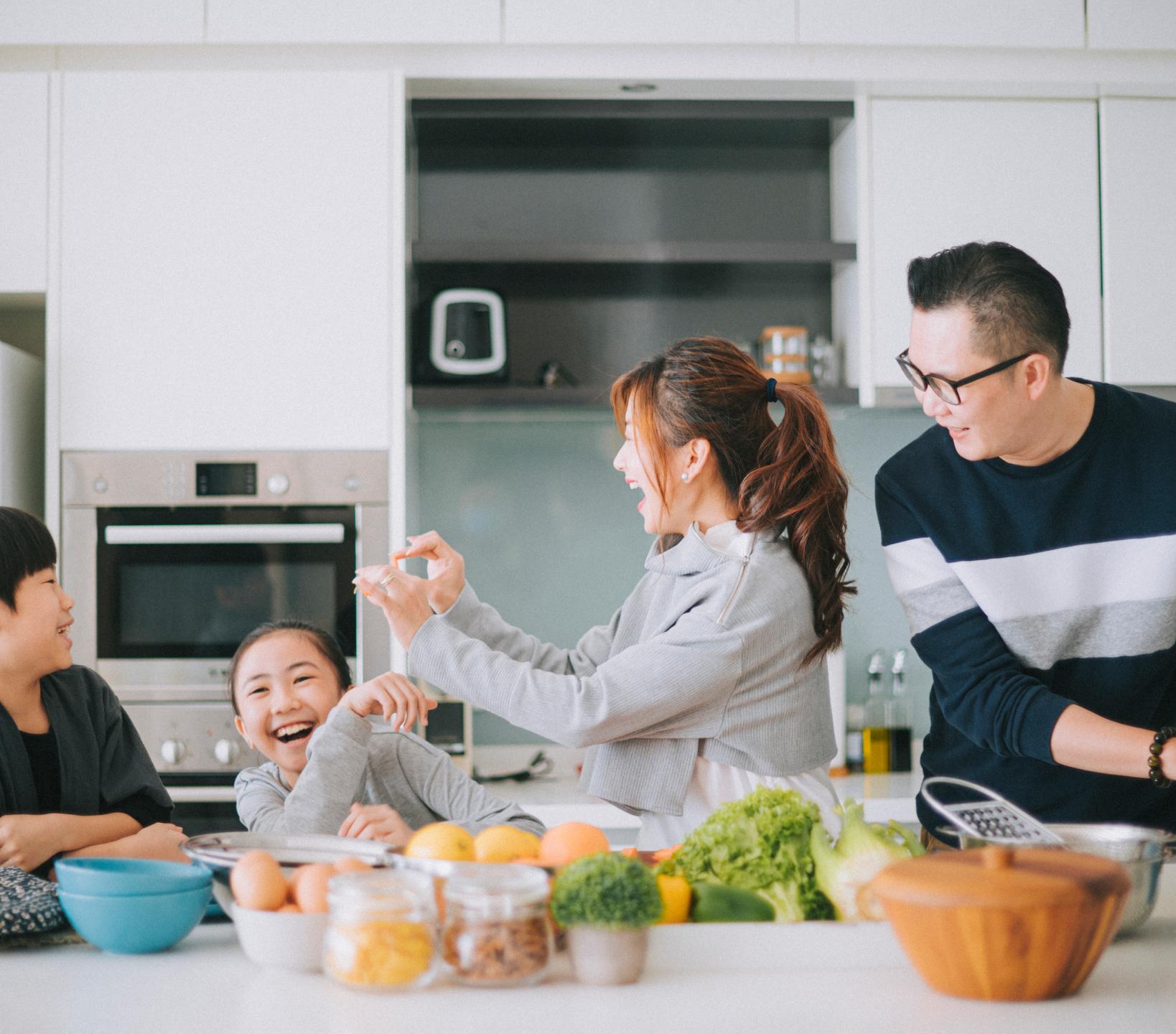 A family prepping food in the kitchen